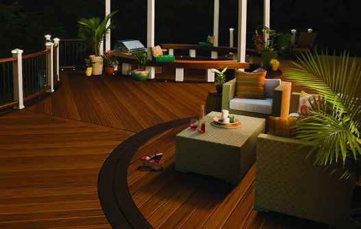 Sofa near table, indoor plants, wooden floor, deck
